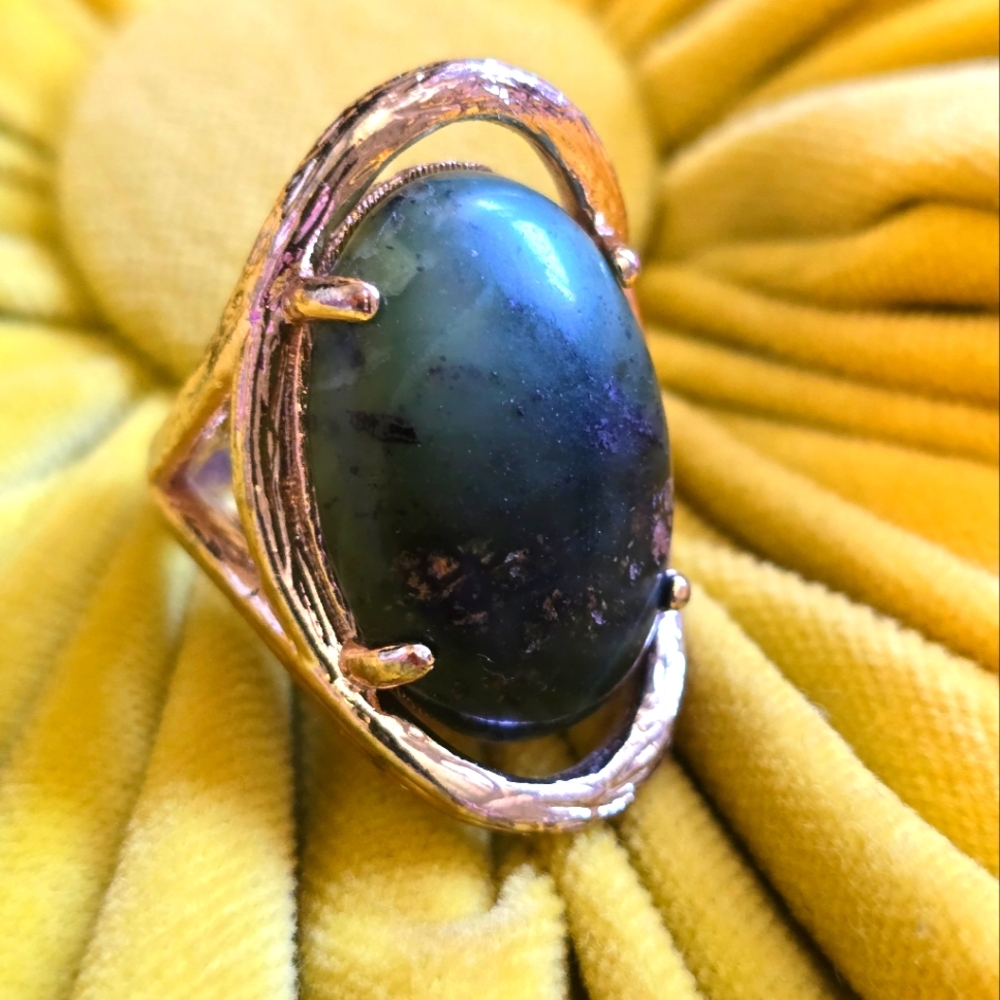 Gold ring with green stone